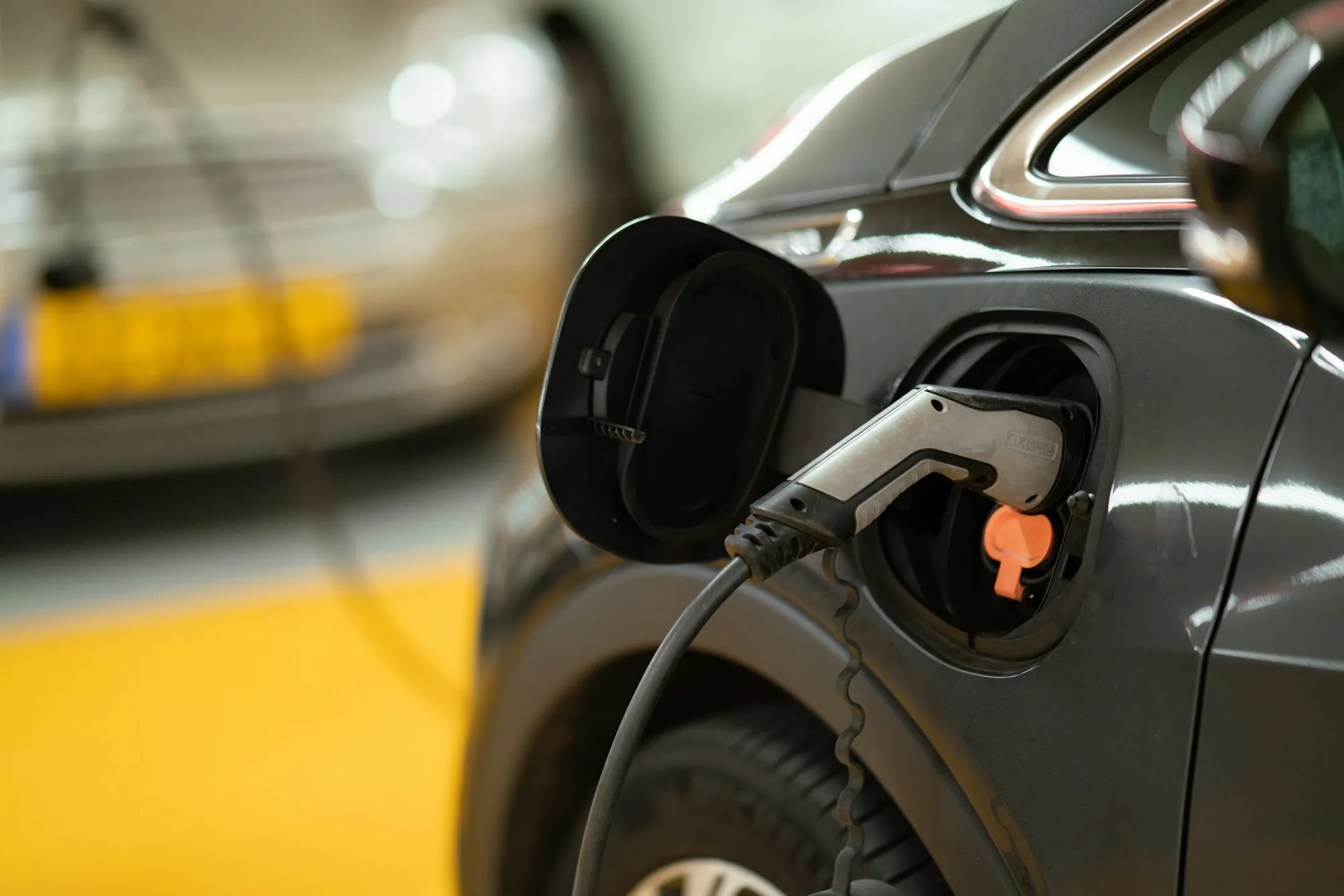 A charging connector attached to a vehicle in a residential setting