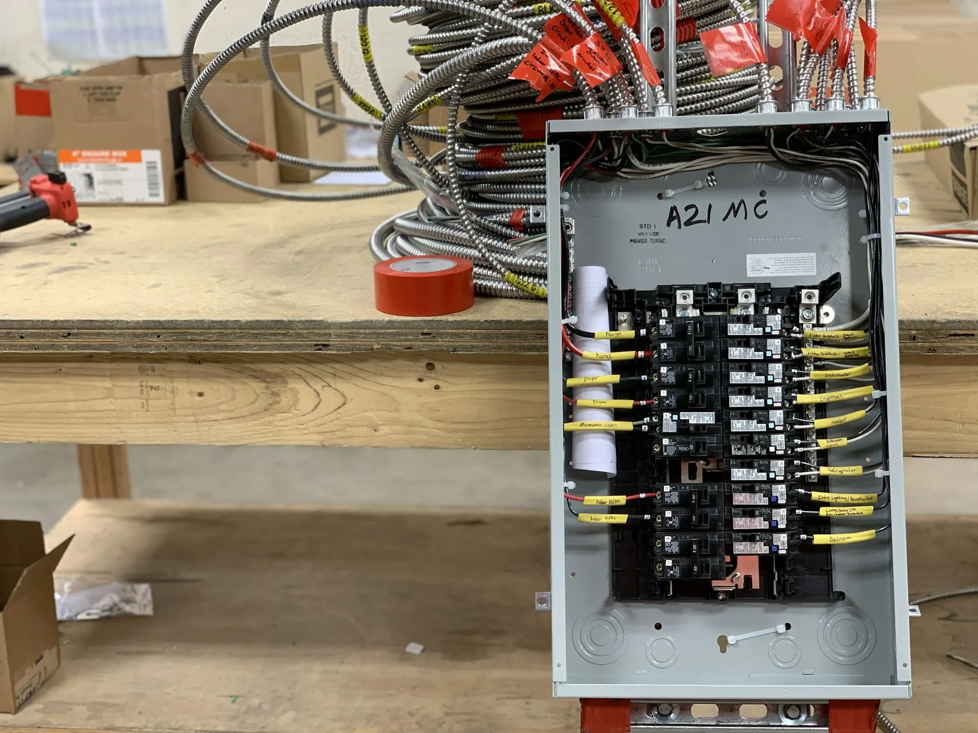 An open residential load centre with breakers and wiring visible