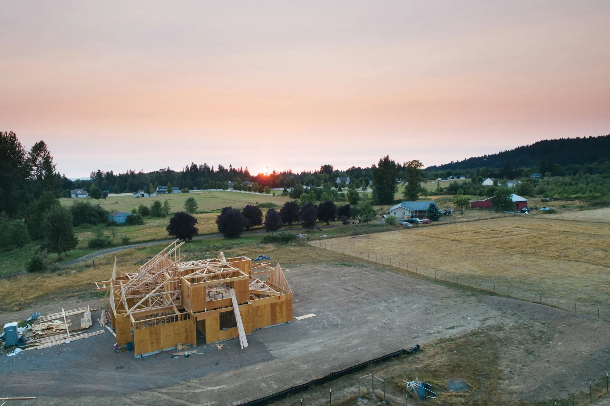 A timber-framed house under construction seen from above